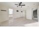 Bright bedroom with mirrored closet doors and hardwood floors at 3655 Funston Way, Las Vegas, NV 89129