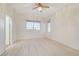 Bright bedroom with wood-look floors and ceiling fan at 3655 Funston Way, Las Vegas, NV 89129