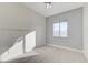 Bedroom with wood-look floors, ceiling fan and gray accent wall at 3655 Funston Way, Las Vegas, NV 89129