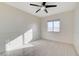 Bedroom with wood-look floors, ceiling fan and wainscoting at 3655 Funston Way, Las Vegas, NV 89129