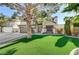 Two-story house with a landscaped yard, large tree, and a two-car garage at 3655 Funston Way, Las Vegas, NV 89129