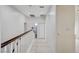 Upstairs hallway with wood-like flooring and white walls at 3655 Funston Way, Las Vegas, NV 89129