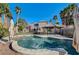 Inviting backyard pool with a covered patio and lush landscaping at 3655 Funston Way, Las Vegas, NV 89129