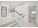 Upstairs hallway with light wood floors and a mirror at 3655 Funston Way, Las Vegas, NV 89129