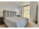 Comfortable bedroom with plush bed and large window at 3726 Las Vegas Blvd # 2310, Las Vegas, NV 89158