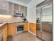 Modern kitchen with stainless steel appliances and light wood cabinets at 3726 Las Vegas Blvd # 2310, Las Vegas, NV 89158