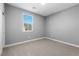 Bright bedroom with gray walls and carpet at 375 Kensington Palace Ave # 3, North Las Vegas, NV 89032