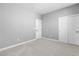 Simple bedroom with gray walls and carpet at 375 Kensington Palace Ave # 3, North Las Vegas, NV 89032