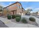 Two-story townhome with attached garage and well-manicured landscaping at 375 Kensington Palace Ave # 3, North Las Vegas, NV 89032