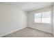 Simple bedroom with neutral carpeting and a window at 3875 Sebasco Dr, Las Vegas, NV 89147