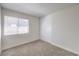 Simple bedroom with neutral carpeting and a window at 3875 Sebasco Dr, Las Vegas, NV 89147