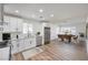 Bright kitchen features white shaker cabinets, stainless steel appliances, and an island at 3875 Sebasco Dr, Las Vegas, NV 89147