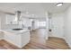 Modern kitchen with white cabinets, an island, and stainless steel appliances at 3875 Sebasco Dr, Las Vegas, NV 89147