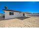 Backyard with covered patio and sandy ground at 4173 Crater St, Las Vegas, NV 89122