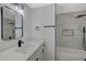 Modern bathroom with marble tile, bathtub and a floating vanity at 4173 Crater St, Las Vegas, NV 89122