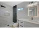 Modern bathroom with marble tile shower, vanity with quartz countertop at 4173 Crater St, Las Vegas, NV 89122