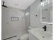 Modern bathroom with marble tile and walk-in shower at 4173 Crater St, Las Vegas, NV 89122