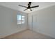 Bedroom with ceiling fan, double-door closet, carpet and window at 4173 Crater St, Las Vegas, NV 89122