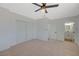 Bedroom with ceiling fan, double-door closet, carpet and ensuite bathroom at 4173 Crater St, Las Vegas, NV 89122