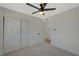 Well-lit bedroom with ceiling fan and double-door closet at 4173 Crater St, Las Vegas, NV 89122