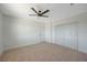 Well-lit bedroom featuring a ceiling fan and double door closet at 4173 Crater St, Las Vegas, NV 89122