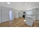 Modern kitchen with white cabinets, stainless steel appliances and an island at 4173 Crater St, Las Vegas, NV 89122