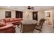 Cozy basement featuring a wet bar, comfortable seating, and access to a powder room at 4450 Palisades Canyon Cir, Las Vegas, NV 89129