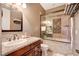 Elegant bathroom with granite vanity, soaking tub, and a walk-in shower at 4450 Palisades Canyon Cir, Las Vegas, NV 89129