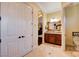 Bathroom featuring a vanity with sink, toilet and view to adjacent room at 4450 Palisades Canyon Cir, Las Vegas, NV 89129