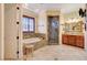 Bathroom featuring double sinks, stand-alone tub and tile shower at 4450 Palisades Canyon Cir, Las Vegas, NV 89129