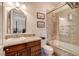 Bathroom with granite vanity, bathtub, and walk-in shower at 4450 Palisades Canyon Cir, Las Vegas, NV 89129