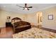 Bedroom featuring ceiling fan and tan floral decorative rug at 4450 Palisades Canyon Cir, Las Vegas, NV 89129