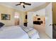 Bright bedroom with hardwood floors, a view to the bath and media room, and neutral decor at 4450 Palisades Canyon Cir, Las Vegas, NV 89129