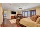 Large bedroom with wood floors, fireplace, and ceiling fan at 4450 Palisades Canyon Cir, Las Vegas, NV 89129