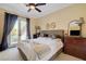 Bedroom with a balcony, hardwood floors, and neutral wall color at 4450 Palisades Canyon Cir, Las Vegas, NV 89129