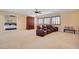 Spacious bedroom featuring four reclining chairs and a view to an adjacent bedroom at 4450 Palisades Canyon Cir, Las Vegas, NV 89129