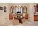 Bright breakfast nook with wood table set and a beautiful chandelier above at 4450 Palisades Canyon Cir, Las Vegas, NV 89129