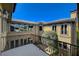 Outdoor view from the balcony looking toward the house shows well-kept landscaping and a beautiful home exterior at 4450 Palisades Canyon Cir, Las Vegas, NV 89129