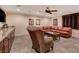 Spacious basement game room with leather seating and wet bar at 4450 Palisades Canyon Cir, Las Vegas, NV 89129