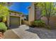 Spacious garage exterior showcasing a custom-designed driveway with pavers at 4450 Palisades Canyon Cir, Las Vegas, NV 89129