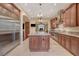 Modern kitchen features granite countertops, stainless steel appliances, and ample wood cabinet space at 4450 Palisades Canyon Cir, Las Vegas, NV 89129