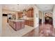 Spacious kitchen boasts modern appliances, granite countertops, ample wood cabinetry and an island at 4450 Palisades Canyon Cir, Las Vegas, NV 89129