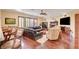 Elegant living room showcases hardwood floors, a fireplace, and a comfortable sectional sofa perfect for relaxing at 4450 Palisades Canyon Cir, Las Vegas, NV 89129