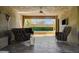 Outdoor living area with a ceiling fan, comfortable seating, and an entertainment center at 4450 Palisades Canyon Cir, Las Vegas, NV 89129