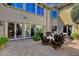 Comfortable outdoor patio features brick pavers, seating area and views of the beautiful home exterior at 4450 Palisades Canyon Cir, Las Vegas, NV 89129