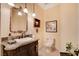 Elegant powder room features a decorative mirror, ornate vanity, and stylish fixtures at 4450 Palisades Canyon Cir, Las Vegas, NV 89129