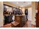 Spacious walk-in closet with dark wood drawers and hanging storage at 4450 Palisades Canyon Cir, Las Vegas, NV 89129