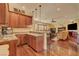 Custom wet bar with granite countertop and cabinets, open to Gathering room at 4450 Palisades Canyon Cir, Las Vegas, NV 89129