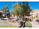 Landscaped grounds with a bench and a tree near building at 4480 Sandy River Dr # 64, Las Vegas, NV 89103