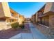 Pathway through the community with building exteriors visible at 4480 Sandy River Dr # 64, Las Vegas, NV 89103